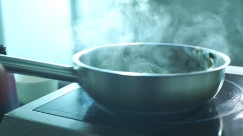 Food Steaming in Silver Pan on Stove