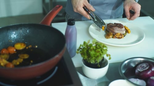 Chef Plating Gourmet Steak Dish