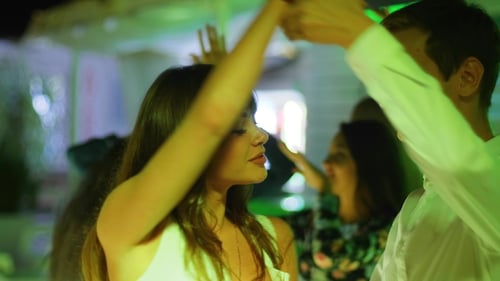 Lovers Dancing a Slow Dance in the Center of Dance Floor