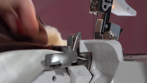 Close Up of Fabric Being Sewn by Serger