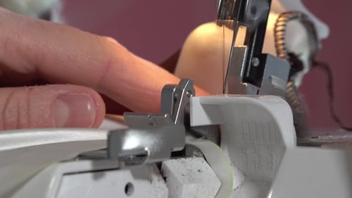 Fabric being stitched in serger sewing machine