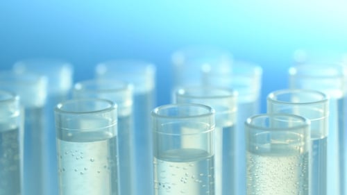 Liquid Dropped into Test Tube in Lab Setting