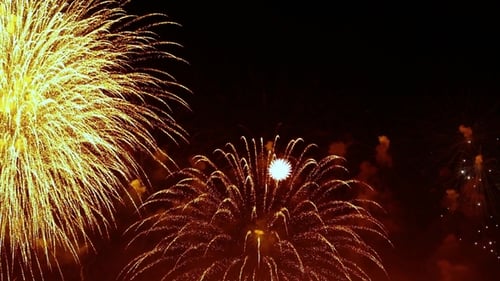 Golden Fireworks Exploding in the Night Sky
