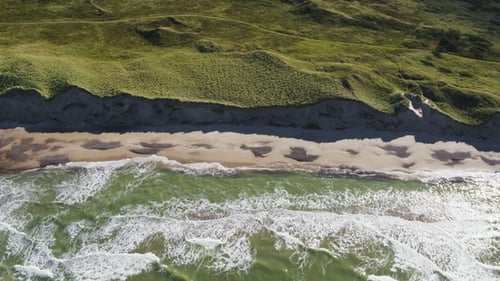 Coastal Waves and Sandy Beach Aerial View