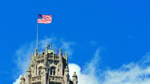 American Flag Waving on Gothic Style Building