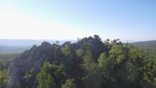 Fir, Birch and Pine Tree Forest Over Rocks Seen From Above. Beautiful Summer Landscape with Rock and