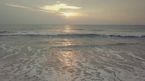 Sunset on the Beach - Tranquil Idyllic Scene of a Golden Sunset Over the Sea, Waves Slowly Splashing