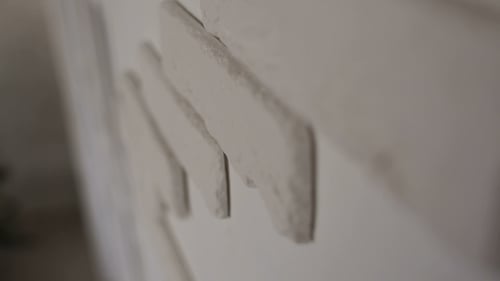 White Wall with Decorative Plaster Texture