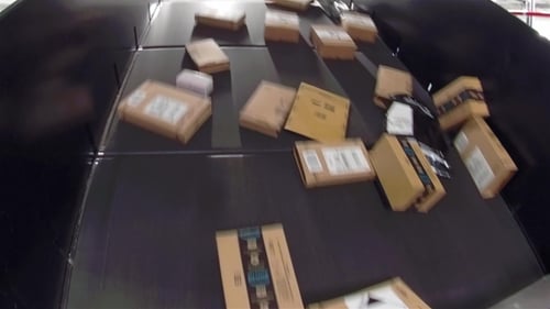 Huge Amount of Parcels Bein Transported on Conveyor Belts