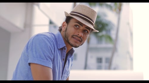 Stylish Man Smiling Outdoors in Tropical Location