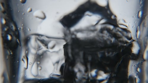 Ice Cubes Are in a Slightly Wet Glass Fresh Water Is Added Later in Studio