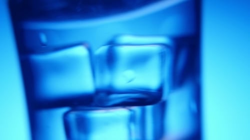 Ice Cubes Swirling in a Glass of Water
