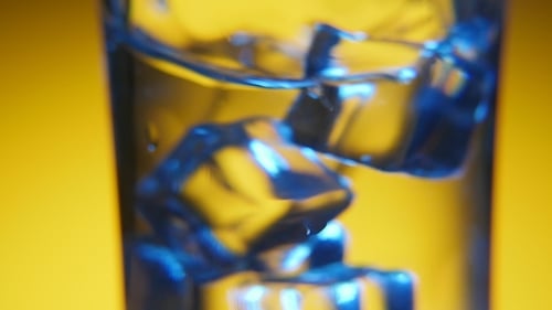 Ice Cubes Shifting Inside Glass Close Up