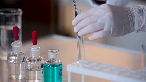 Lab Worker Performing a Chemical Experiment