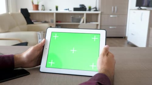 Holding a Digital Tablet PC in Hands with Green Screen Chroma Mock Up