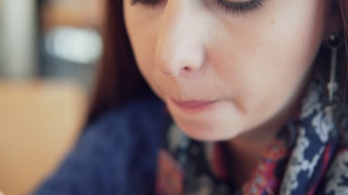 Woman Eating Ice Cream in a Cafe