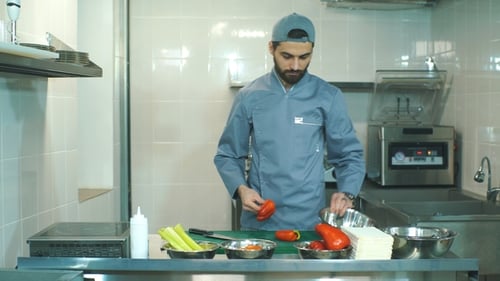Chef Cuts Vegetables in the Kitchen