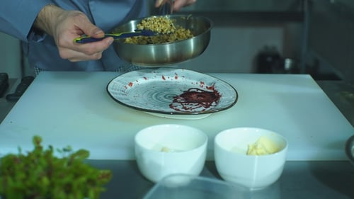 Chef Prepares Gourmet Dish in Professional Kitchen