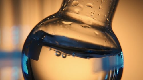 Distilled Water Is Shaken in a Round Bottom Flask in a Medical Laboratory