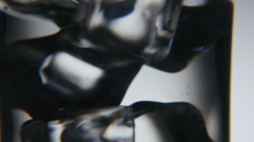Melting Ice Cubes in a Glass Close-up