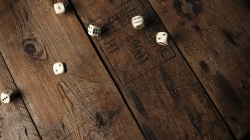 Dice Rolling on a Wooden Table