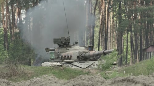 Military Tank Shoots On The Target
