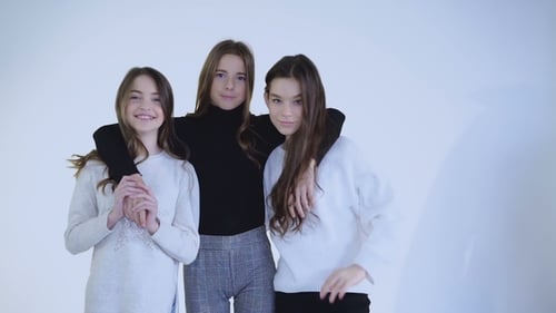 Three Young Friends Smiling and Posing Together