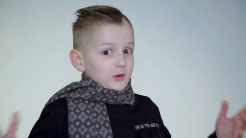 Surprised Young Boy Complainting and Arguing at Camera