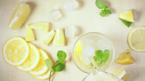 Refreshing Lemon Drink Preparation with Mint and Ice
