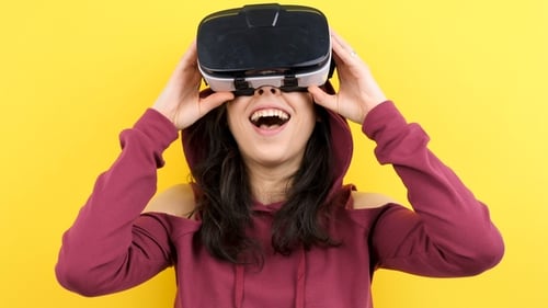 Young Woman Enjoys Virtual Reality Experience