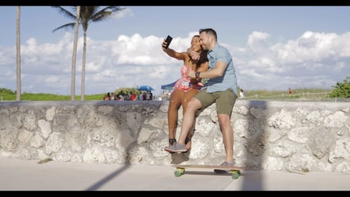 Happy Couple Taking Selfie by the Beach
