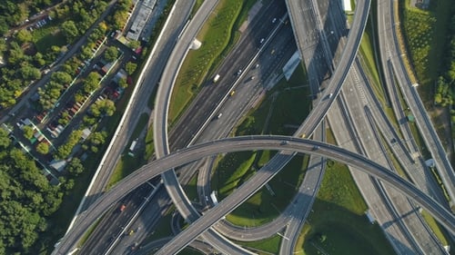 Complex Road Junction and Cars Traffic. Aerial View. Drone Is Spinning
