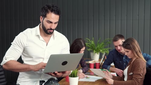 Young Adults Collaborating in Office Workplace