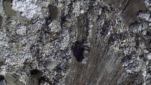 Bulldozer Operating at Large Urban Landfill Aerial View
