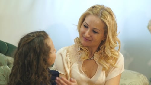 Loving Mother Hugs Child with Affection Indoors