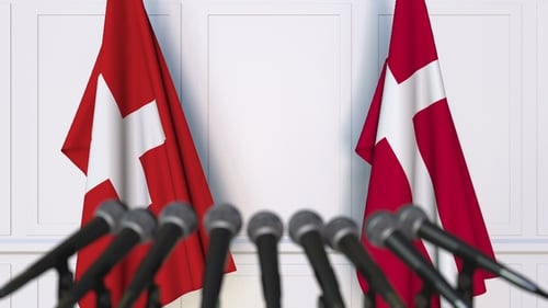 Switzerland and Denmark Flags at Corporate Press Conference