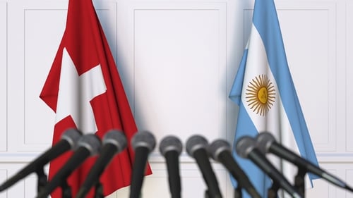 Flags of Switzerland and Argentina at International Press Conference
