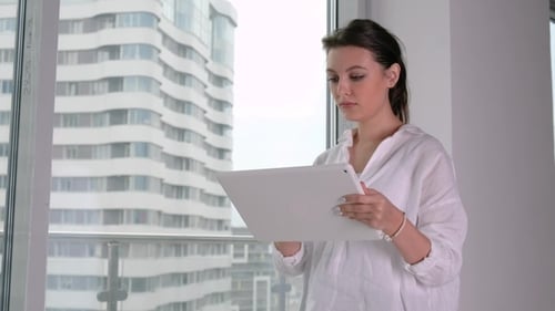 Young Businesswoman Using Tablet in Office