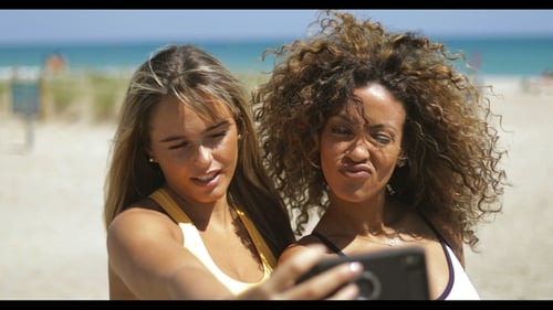 Playful Women Posing for Selfie on Beach