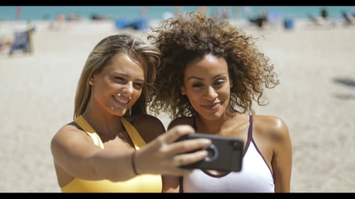 Sportive Women Taking Selfie on Beach