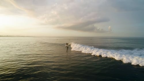Surfing: Surfer Man Riding on the Blue Waves
