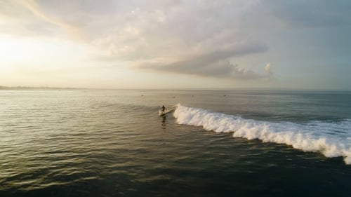 Surfing: Surfer Man Riding on the Blue Waves