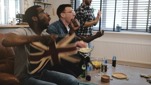 Friends Excitedly Watch Sports at Home