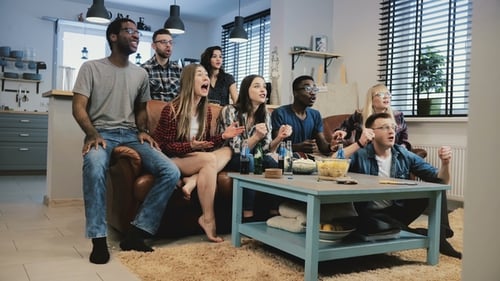 Friends Watching a Game and Cheering Together
