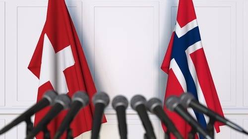 Flags of Switzerland and Norway at International Press Conference