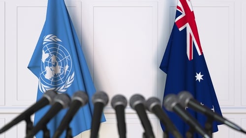 Flags of the United Nations and Australia at International Press Conference