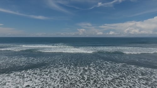 Tropical Exotic Beach with Volcanic Sand, Blue Sky with Clouds