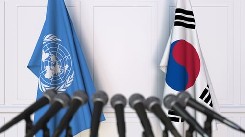 UN and South Korea Flags Waving at Diplomatic Press Conference