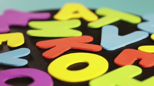 Brightly Colored Letters on a Black Background