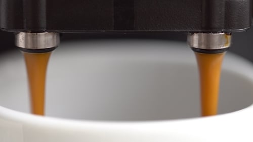 Close Up Coffee Pouring into a Mug